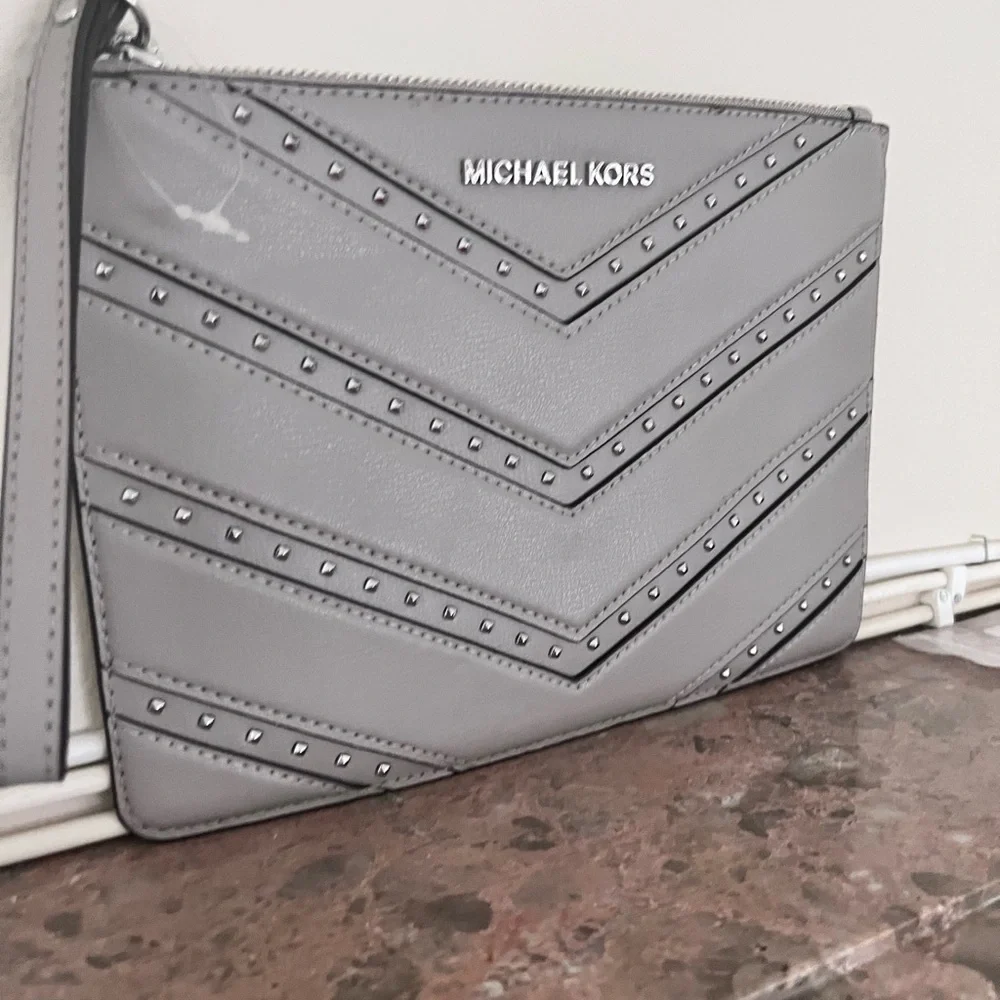 Michael Kors studded wristlet